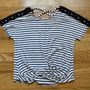 Women’s black and white shirt.